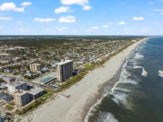 bird's eye view featuring a view of the beach and a water view