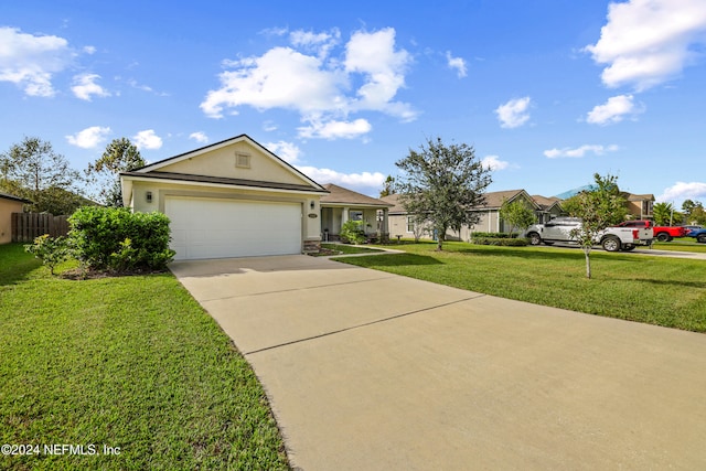 ranch-style home featuring a garage and a front lawn