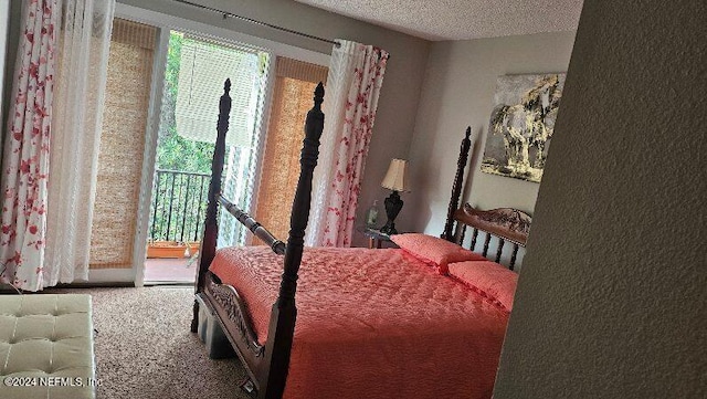 carpeted bedroom with a textured ceiling, access to outside, and multiple windows