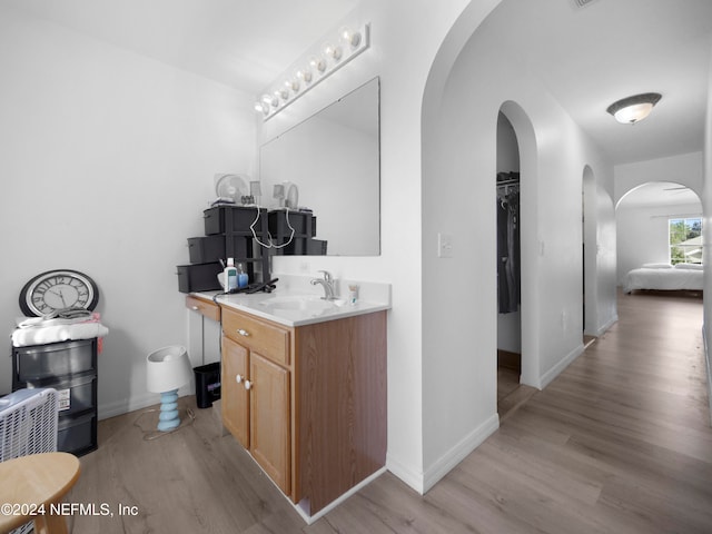 bathroom with vanity and hardwood / wood-style floors