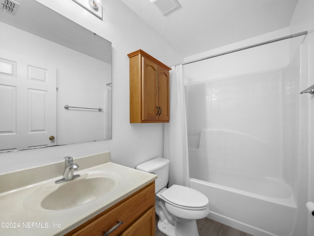 full bathroom featuring vanity, shower / tub combo with curtain, toilet, and wood-type flooring