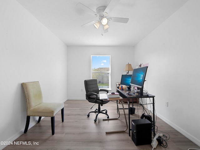 office with ceiling fan and hardwood / wood-style flooring