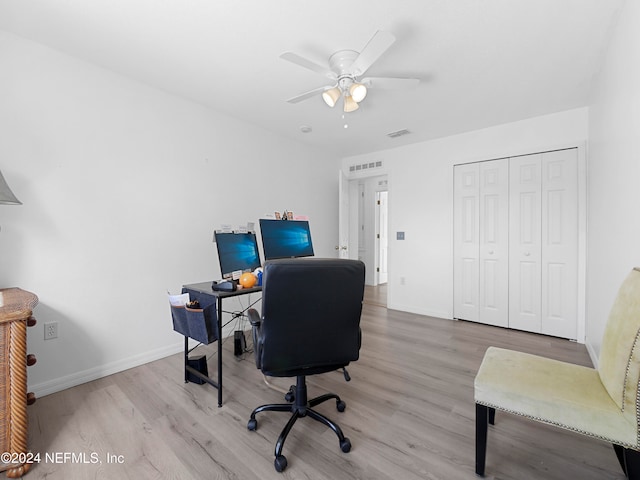 office area featuring light hardwood / wood-style flooring and ceiling fan