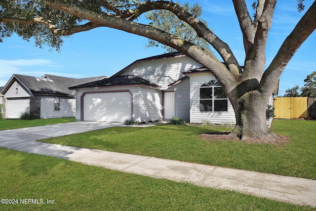 single story home featuring a front yard and a garage