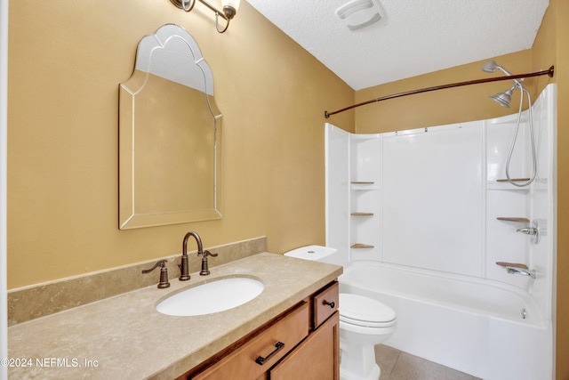 full bathroom with a textured ceiling, vanity, bathtub / shower combination, tile patterned floors, and toilet