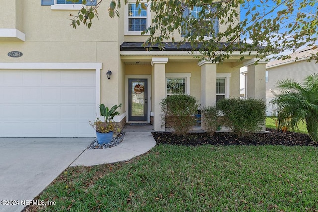 view of front facade featuring a garage and a front yard