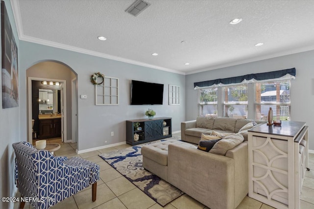 tiled living room featuring a textured ceiling and crown molding