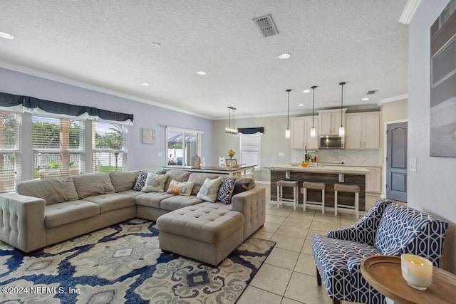 living room featuring ornamental molding, a textured ceiling, and light tile patterned flooring