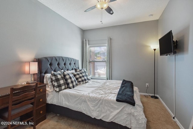 bedroom featuring ceiling fan and light carpet