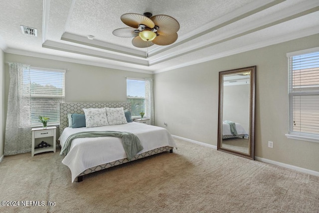 bedroom with ornamental molding, multiple windows, light colored carpet, and ceiling fan