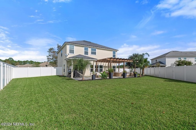 rear view of house featuring a lawn, a patio, and a pergola