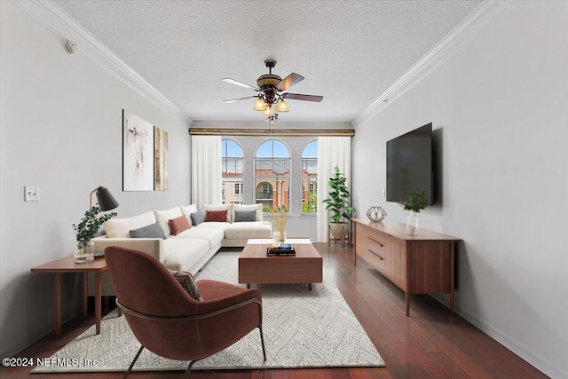 living room with dark wood-type flooring, crown molding, a textured ceiling, and ceiling fan