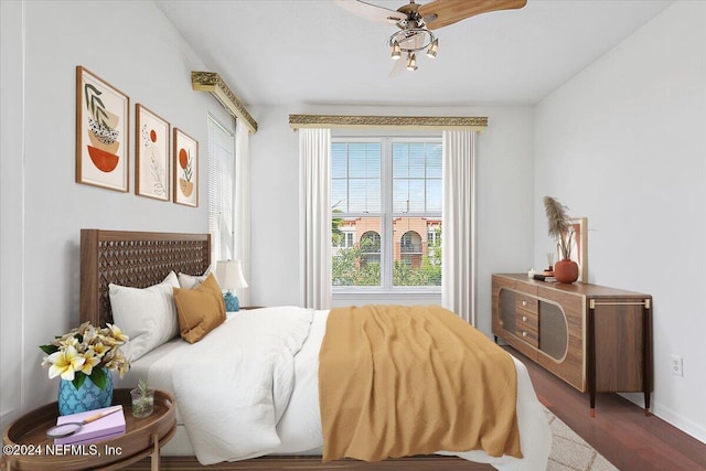 bedroom with ceiling fan and wood-type flooring