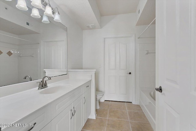 full bathroom featuring vanity, toilet, tile patterned floors, and tiled shower / bath combo