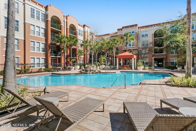 view of swimming pool featuring a patio