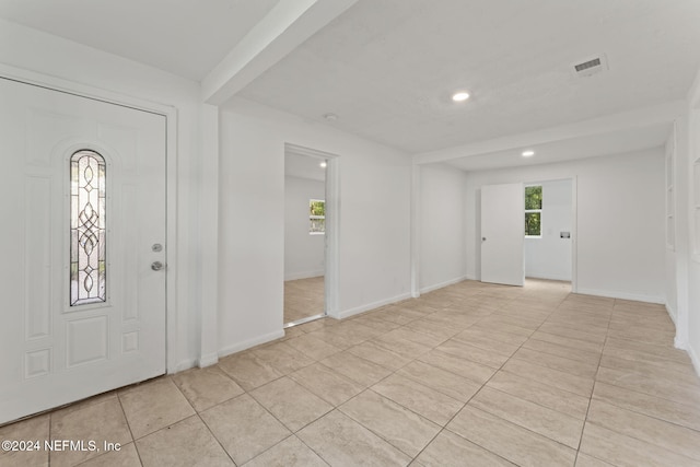 entrance foyer with light tile patterned floors