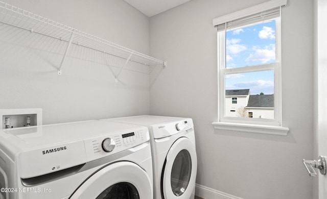 washroom featuring washer and dryer