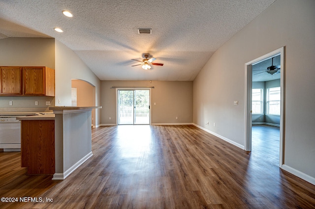 kitchen with kitchen peninsula, ceiling fan, a textured ceiling, dishwasher, and dark wood-type flooring