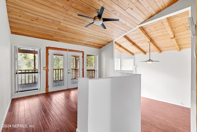 interior space featuring french doors, vaulted ceiling with beams, and hardwood / wood-style floors