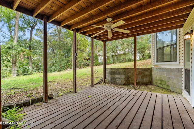 deck with ceiling fan and a lawn