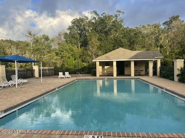 view of pool featuring a patio