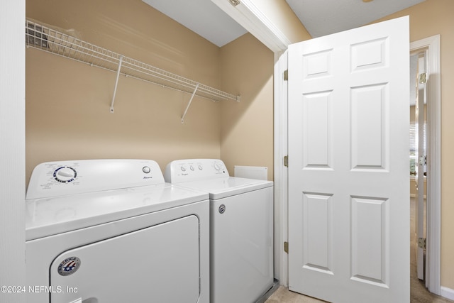 laundry area with washing machine and dryer