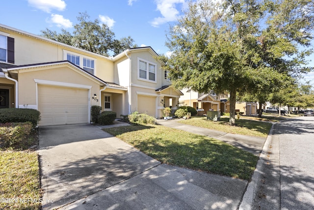 townhome / multi-family property with a garage