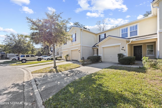 exterior space with a garage and a front yard