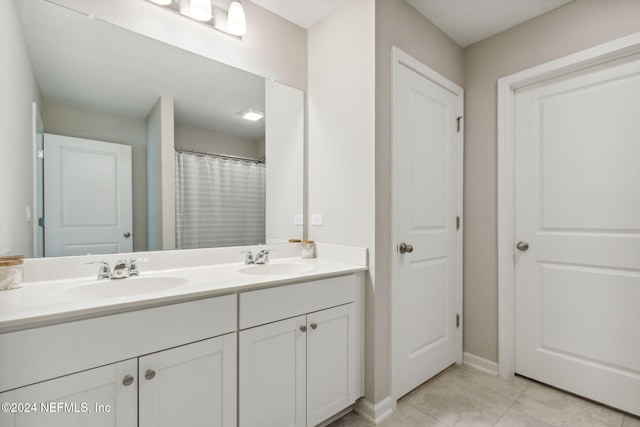 bathroom with vanity and tile patterned flooring