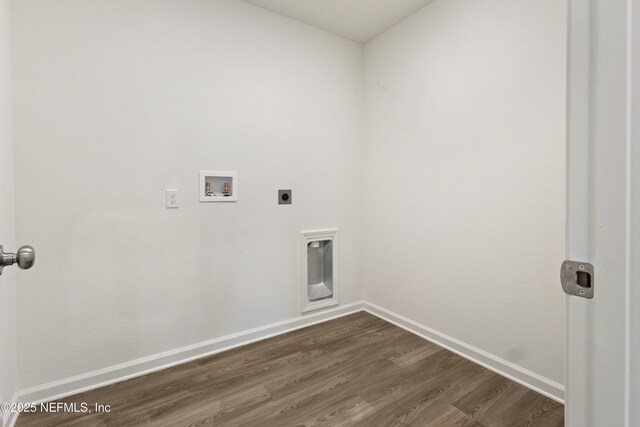 744 Hunter Rd, Hollister, FL 32177 - clothes washing area with washer hookup, hookup for an electric dryer, dark wood-style flooring, and baseboards