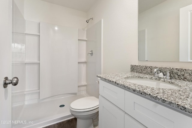 744 Hunter Rd, Hollister, FL 32177 - full bathroom with toilet, a shower, vanity, and wood finished floors
