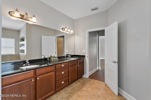 bathroom with vanity and tile patterned floors