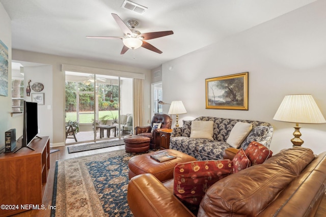 8757 Little Swift Cir Unit 22F, Jacksonville, FL 32256 - living area featuring ceiling fan, wood finished floors, and baseboards