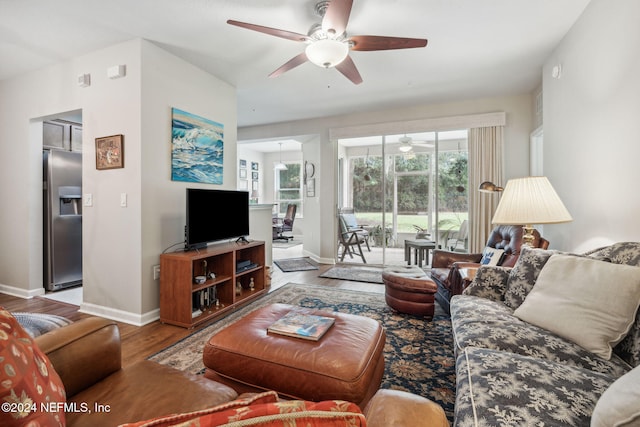 living room featuring hardwood / wood-style flooring and ceiling fan