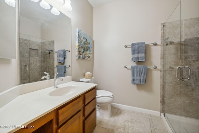 8757 Little Swift Cir Unit 22F, Jacksonville, FL 32256 - bathroom with toilet, vanity, a shower stall, tile patterned flooring, and baseboards