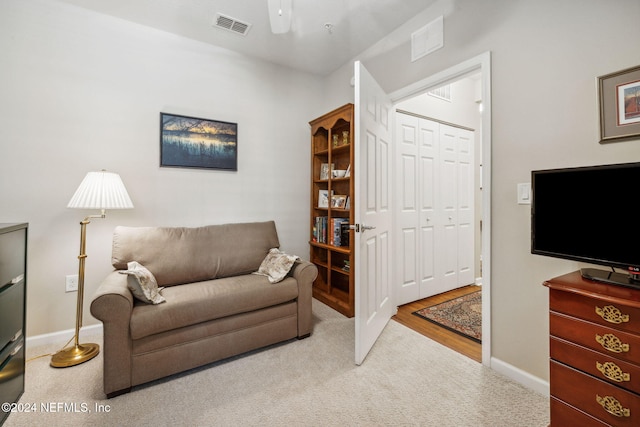 8757 Little Swift Cir Unit 22F, Jacksonville, FL 32256 - sitting room with carpet flooring, a ceiling fan, and baseboards