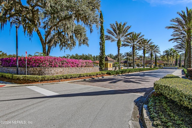 8757 Little Swift Cir Unit 22F, Jacksonville, FL 32256 - view of asphalt street featuring curbs