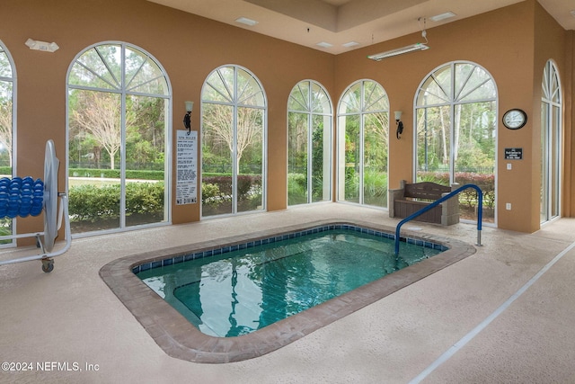 view of swimming pool featuring a swimming pool and an indoor in ground hot tub