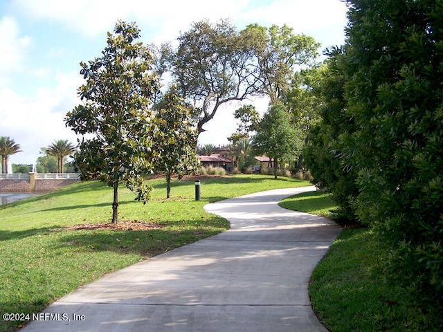 8757 Little Swift Cir Unit 22F, Jacksonville, FL 32256 - view of property's community with a lawn