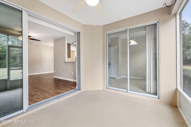 empty room with ceiling fan and carpet flooring