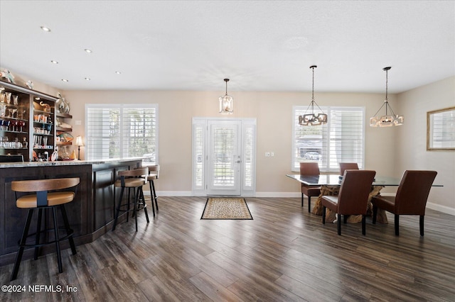 dining space featuring dark wood-type flooring