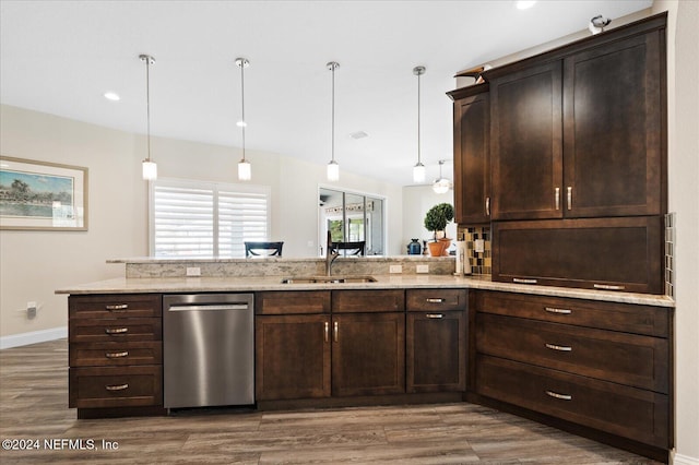 kitchen with stainless steel dishwasher, sink, kitchen peninsula, and wood-type flooring