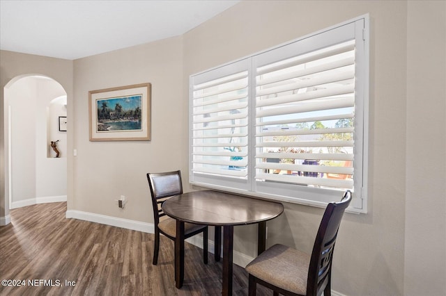 dining area with dark wood-type flooring