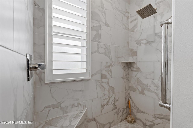 bathroom with tiled shower