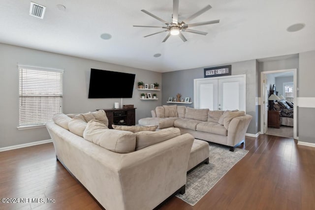 living room featuring french doors, dark hardwood / wood-style floors, and ceiling fan