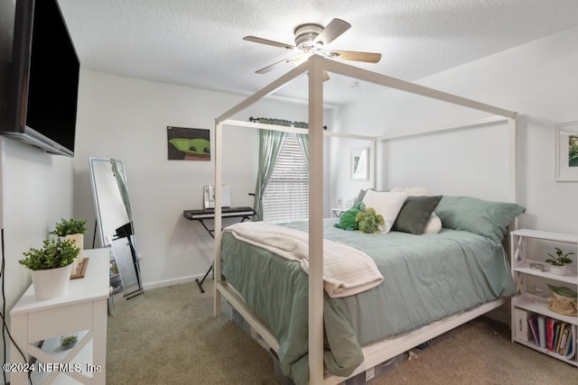 bedroom featuring a textured ceiling, carpet, and ceiling fan