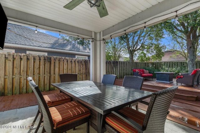 exterior space featuring ceiling fan