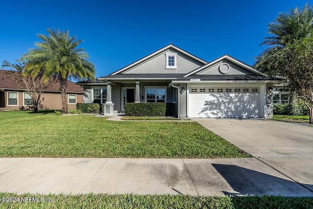 ranch-style home with a front yard and a garage