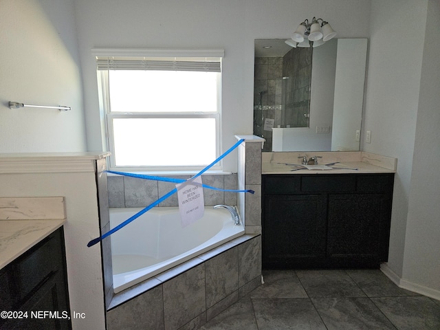 bathroom with vanity, shower with separate bathtub, and tile patterned floors