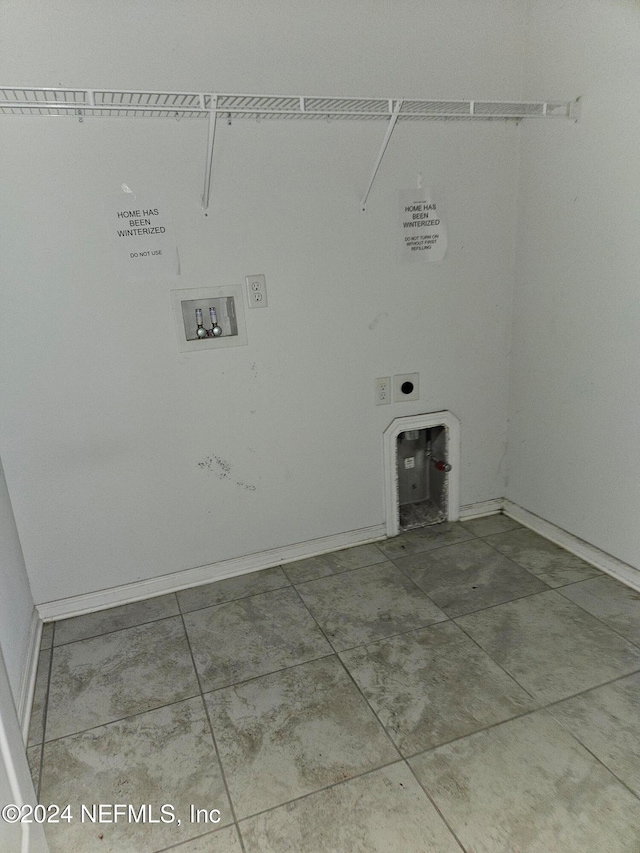 laundry room featuring hookup for an electric dryer and hookup for a washing machine